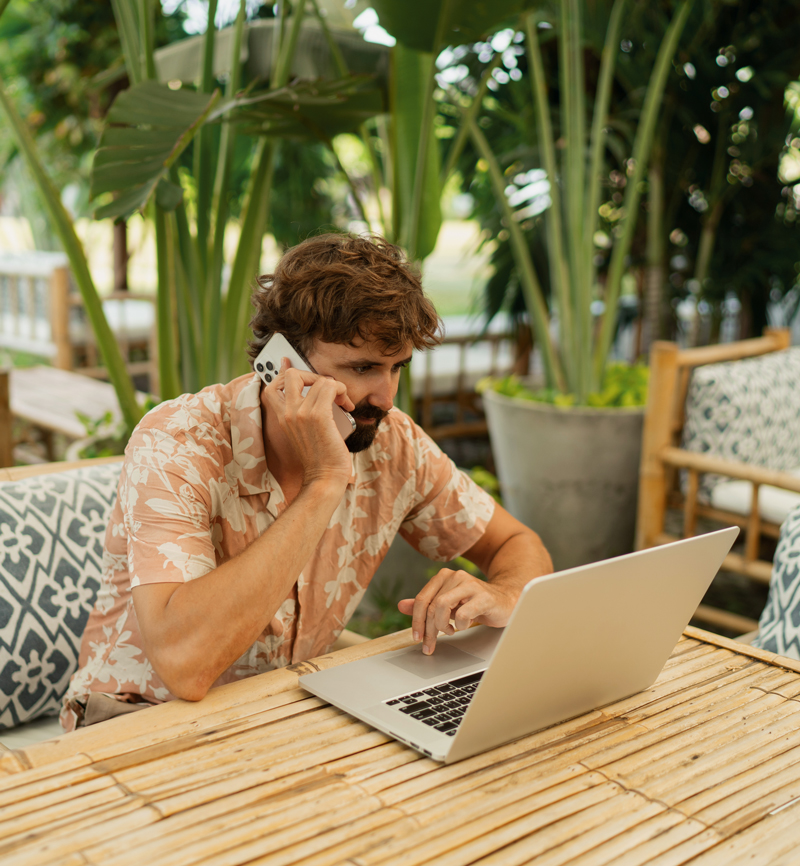 <a href="https://www.freepik.com/free-photo/handsome-man-with-beard-using-lap-top-mobyle-phone-sitting-outdoor-cafe-with-tropical-interior_23233157.htm#query=digital%20nomad&position=28&from_view=search&track=ais">Image by svetlanasokolova</a> on Freepik